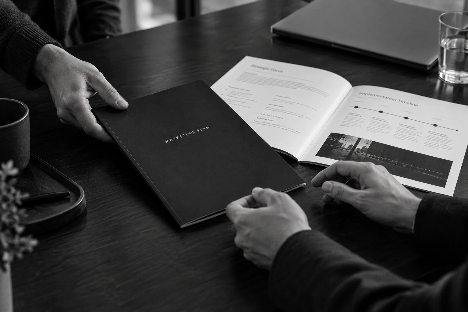 A written marketing plan being delivered and reviewed at a meeting.
