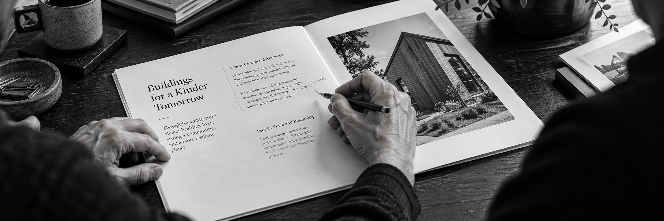 An editor checking a polished proof spread and making a careful correction.
